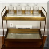 F24. Brass bar cart. 33"h x 33"w x 14"d 